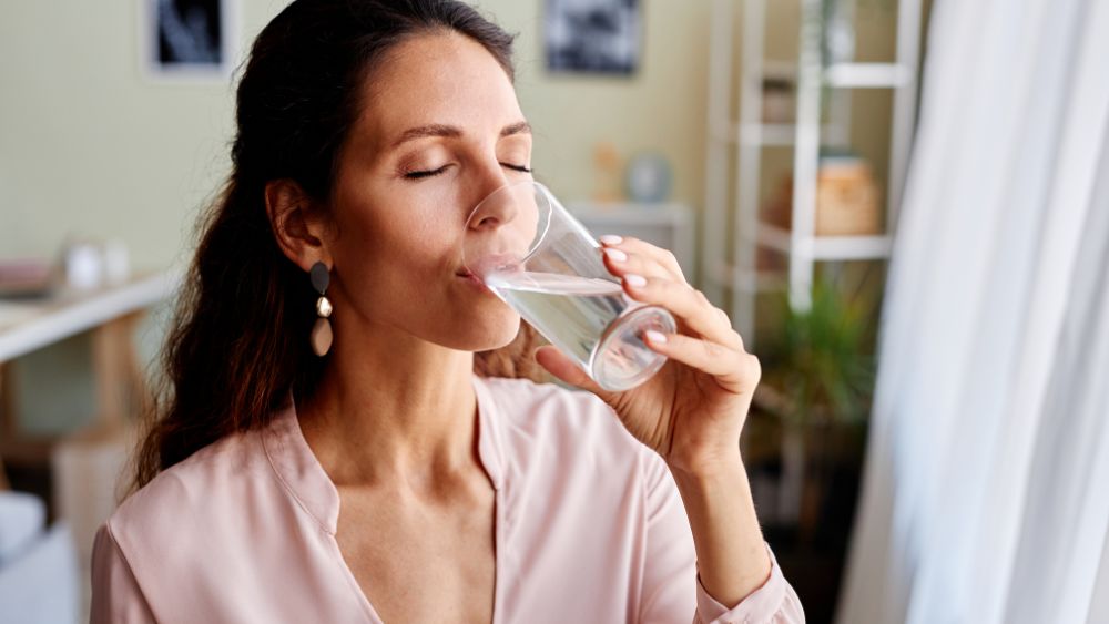 Woman Drinking Water Healthy Skin - symmetrica Blog